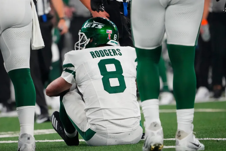 Aaron Rodgers #8 sitting down after an injury from a sack by Leonard Floyd #56 during a NFL Game on September 11, 2023.


Robert Deutsch- USA TODAY Sports