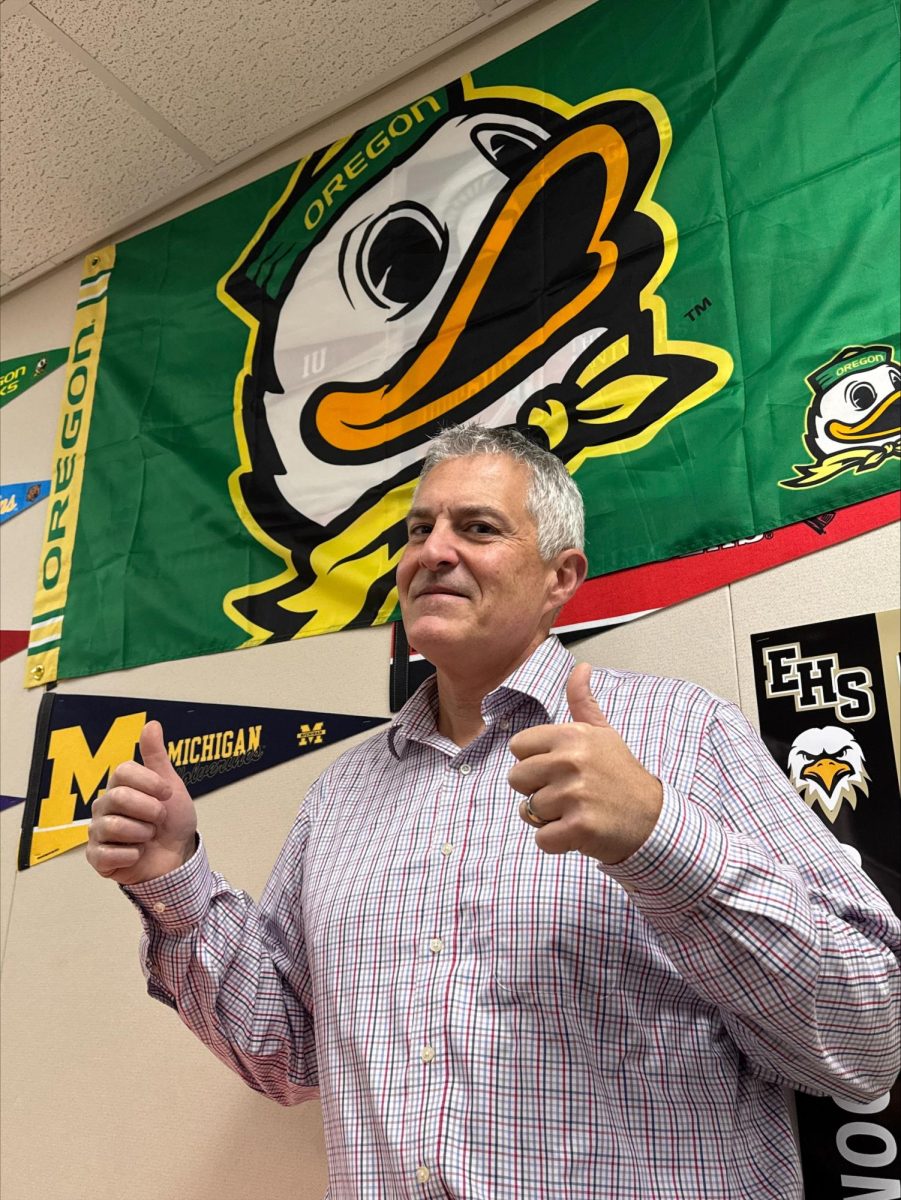 Mr. Farinha (gleefully) posing behind the Oregon Ducks