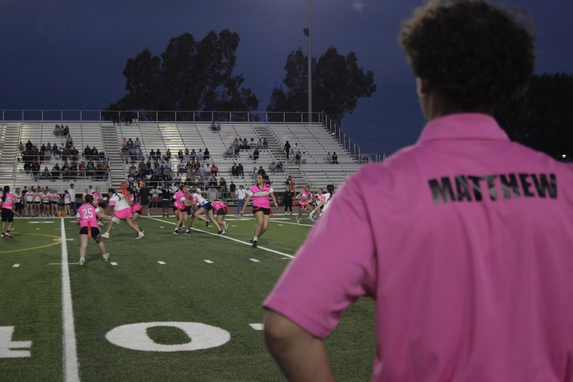 Senior Matthew Bercham looks on the game as one of the coaches.